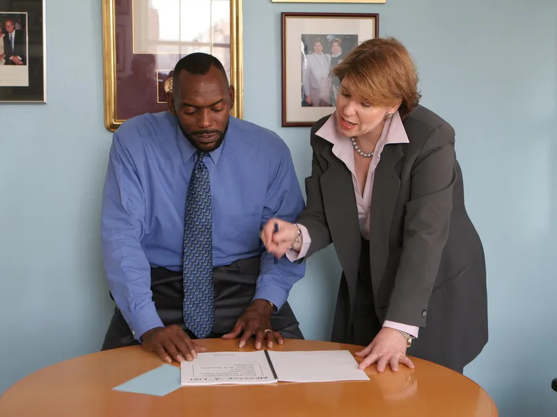 Heidi Berenson reviewing talking points with a client